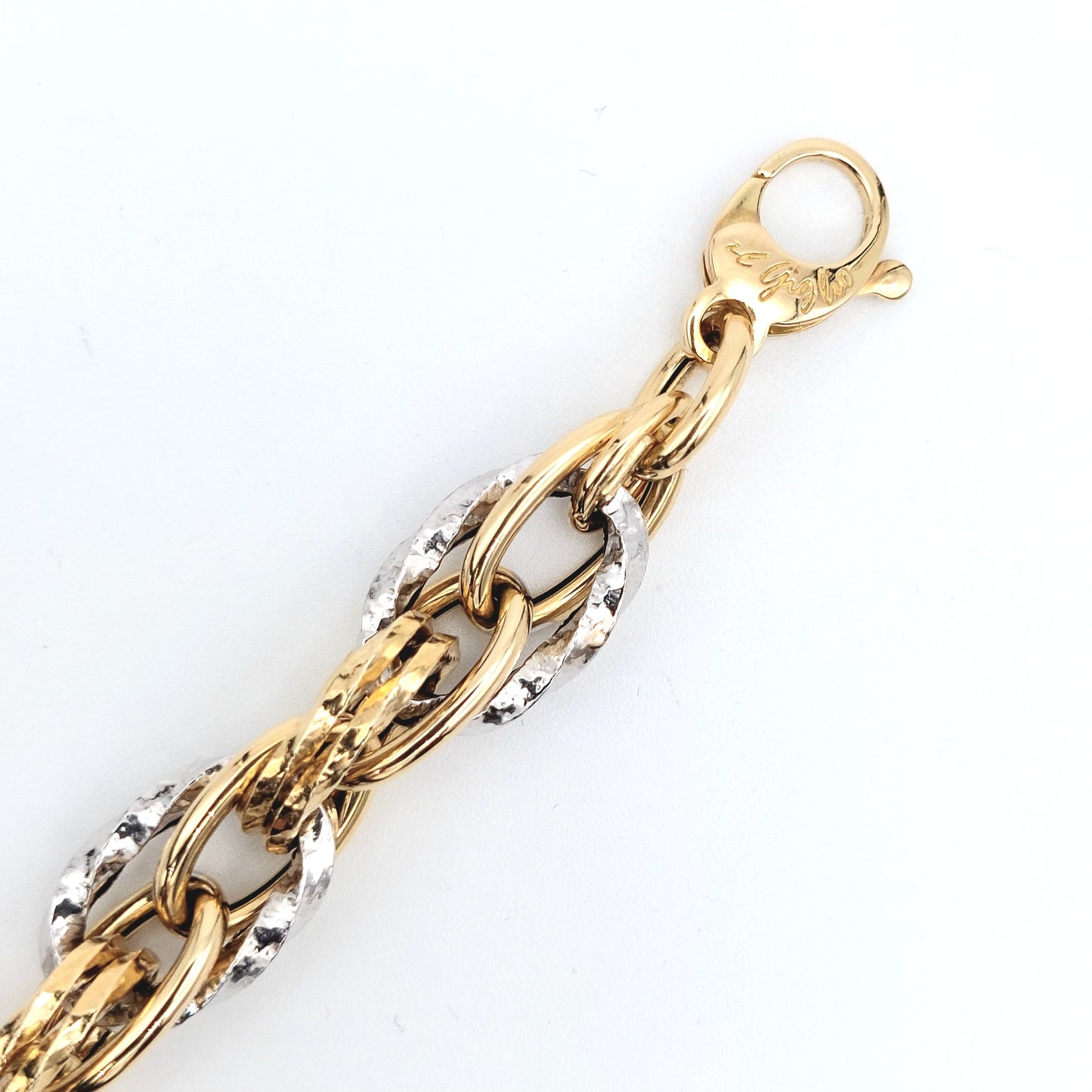 Bracciale a catena da donna in oro giallo e bianco 18 KT. BR-D-ORO062.